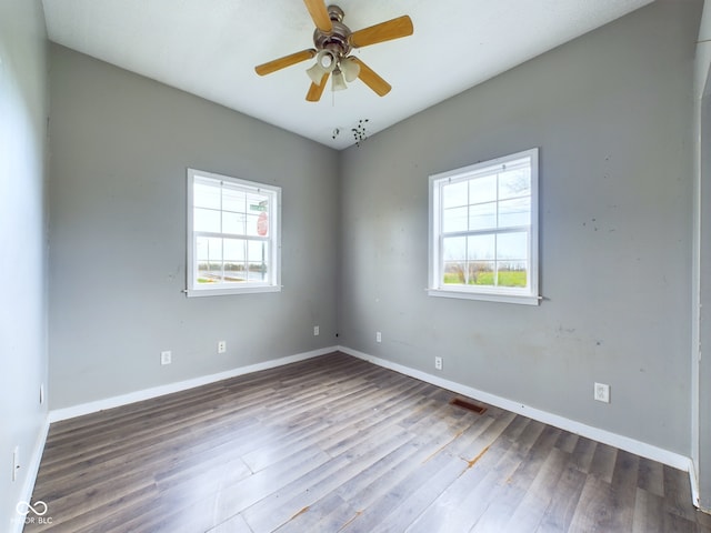 31 S Superior St, Orestes, IN 46063 - spare room with healthy amount of natural light, wood finished floors, and ceiling fan