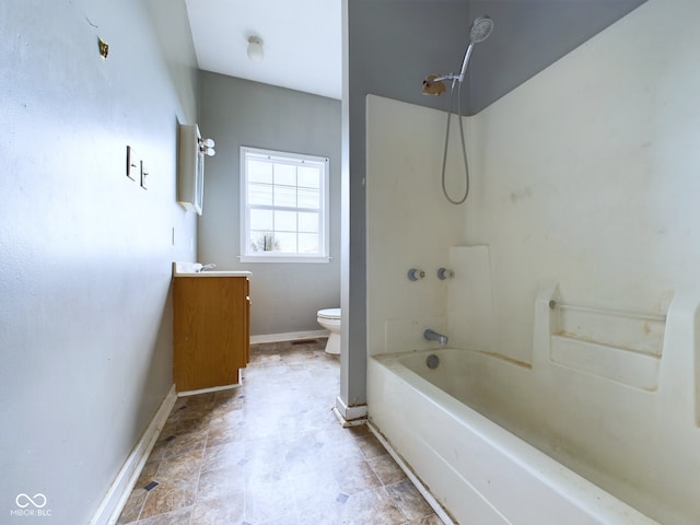 full bathroom featuring vanity, bathing tub / shower combination, and toilet