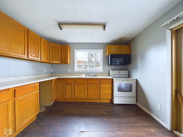 kitchen featuring a textured ceiling, dark hardwood / wood-style floors, white electric range, and sink