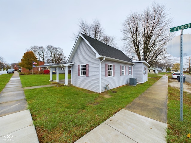 view of home's exterior featuring a lawn and cooling unit