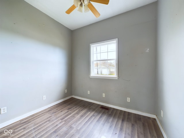 empty room featuring ceiling fan and light wood-type flooring