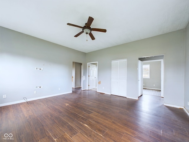 interior space featuring ceiling fan and dark hardwood / wood-style floors