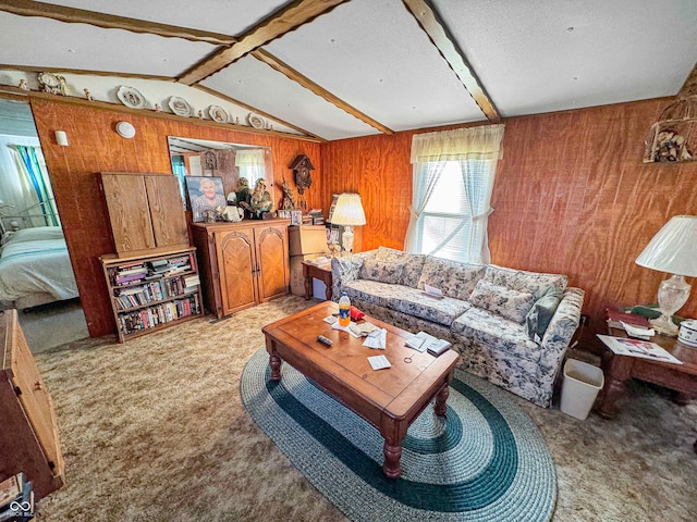 carpeted living room featuring vaulted ceiling with beams and wooden walls