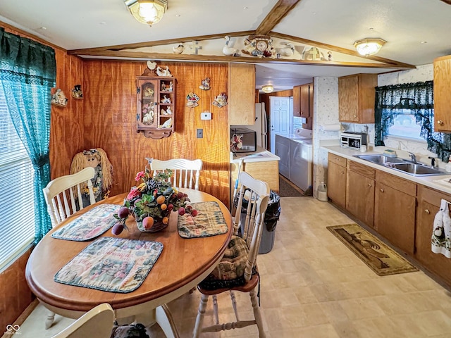 4355 E Streacher Rd, Bloomington, IN 47408 - dining area with washer and clothes dryer, lofted ceiling, and wooden walls