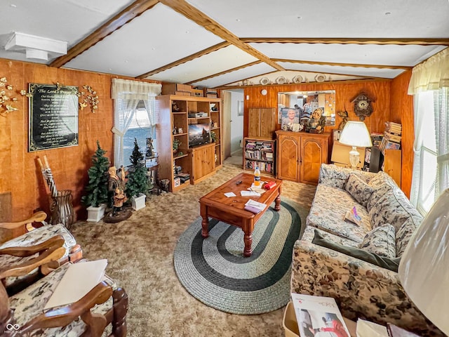 living room with vaulted ceiling with beams, wooden walls, and a healthy amount of sunlight