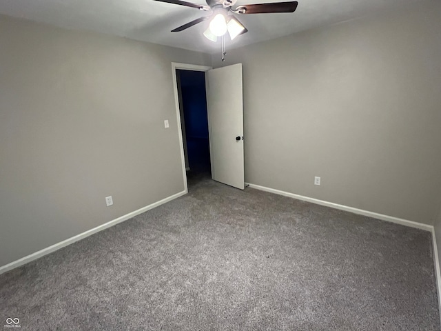 empty room with carpet flooring and ceiling fan