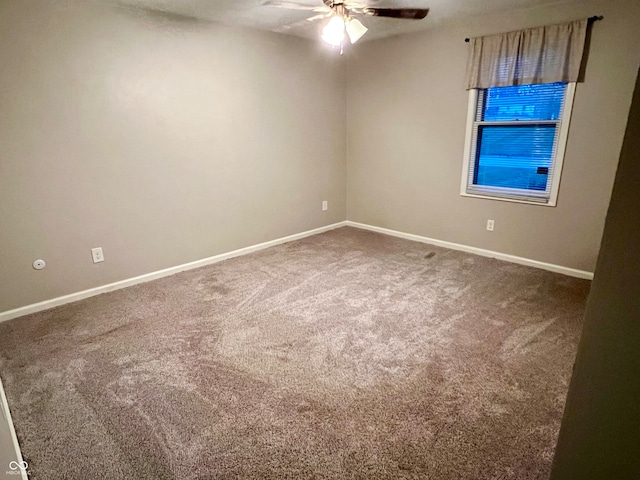 empty room featuring carpet and ceiling fan