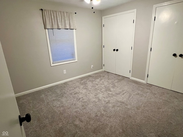 unfurnished bedroom with light colored carpet