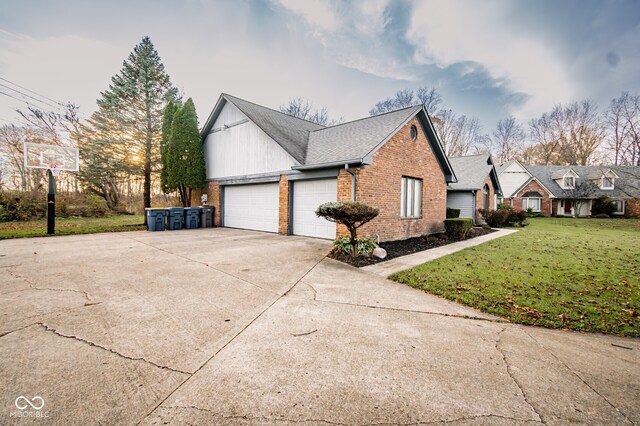 view of home's exterior featuring a yard and a garage