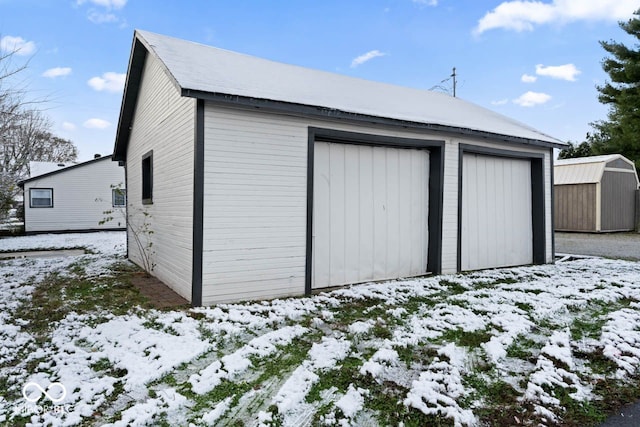 view of snow covered garage