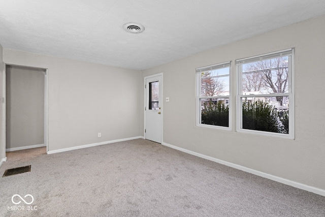 unfurnished room featuring carpet floors