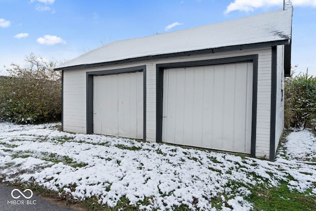 view of snow covered garage