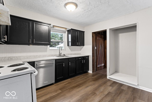 kitchen with stainless steel dishwasher, dark hardwood / wood-style flooring, sink, and a textured ceiling