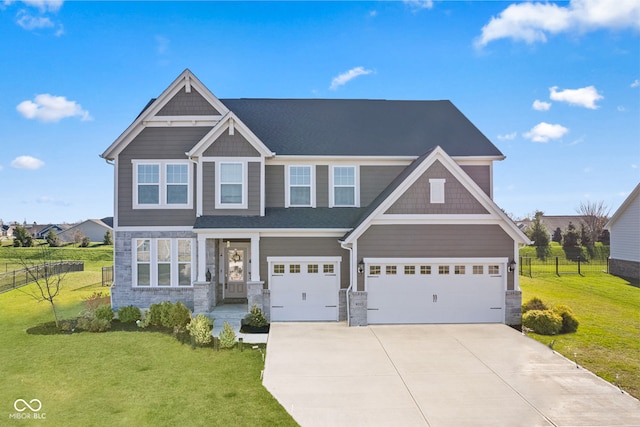 craftsman-style home featuring a front yard and a garage