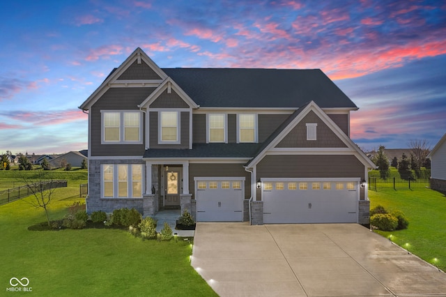 craftsman house with a yard and a garage