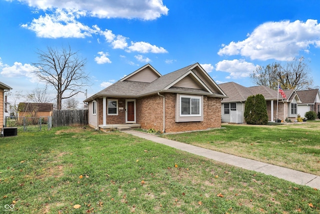 view of front of home featuring a front yard and central AC