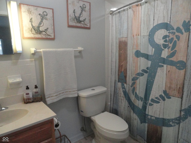 bathroom featuring walk in shower, vanity, and toilet