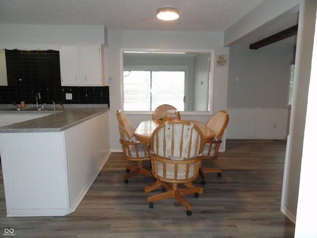 dining area with dark hardwood / wood-style flooring