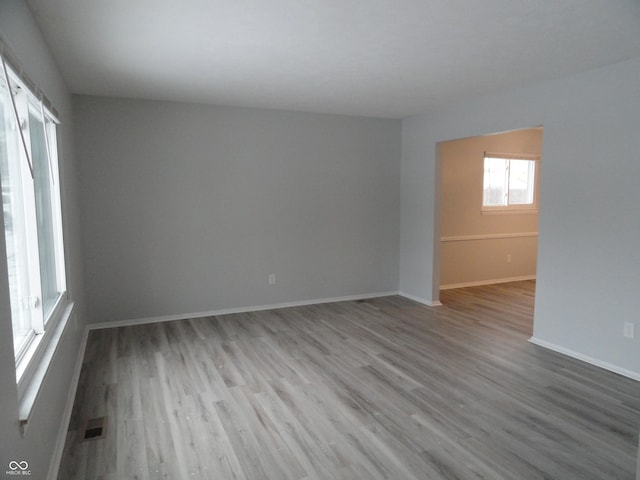 spare room with light hardwood / wood-style floors