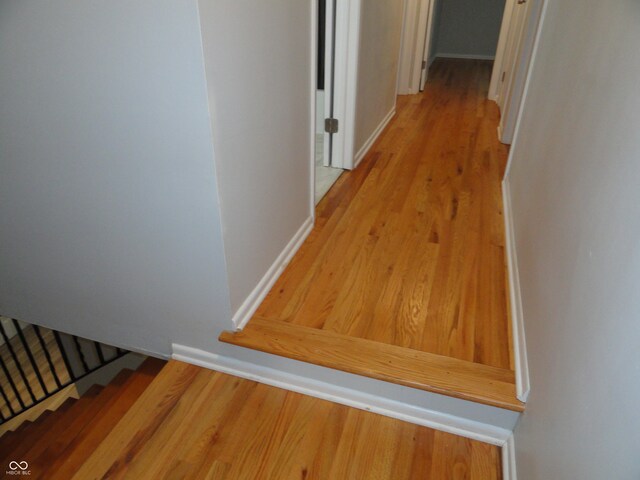 hall with light hardwood / wood-style flooring