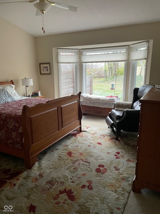 bedroom featuring ceiling fan and carpet floors