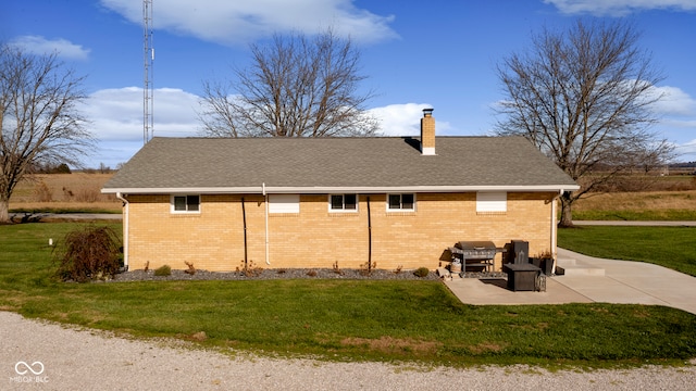 view of property exterior featuring a yard and a patio