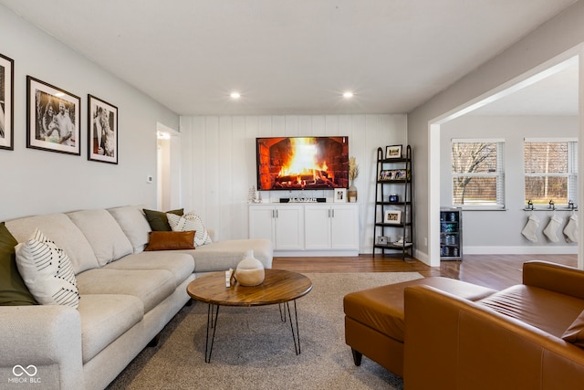 living room featuring wood-type flooring and indoor bar