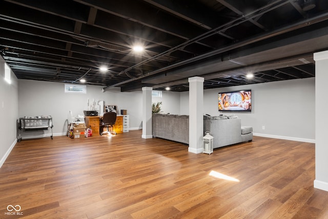 basement with hardwood / wood-style flooring