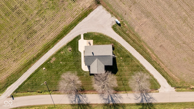 birds eye view of property with a rural view