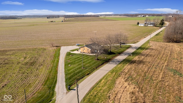 birds eye view of property with a rural view