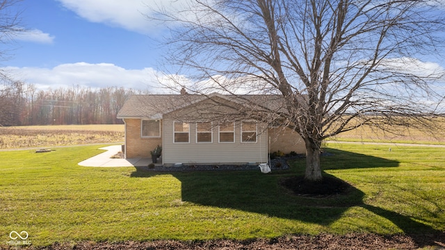 view of property exterior featuring a yard