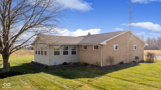 view of home's exterior featuring a yard