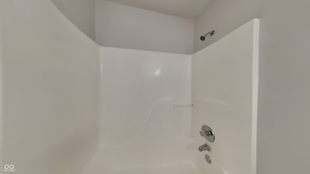 bathroom with bathing tub / shower combination