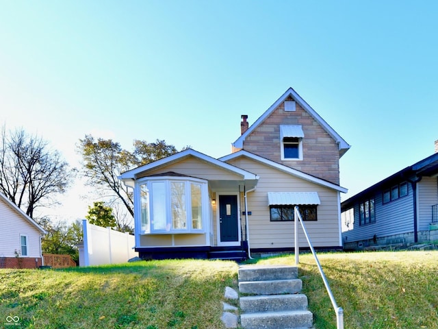 view of front of house with a front lawn