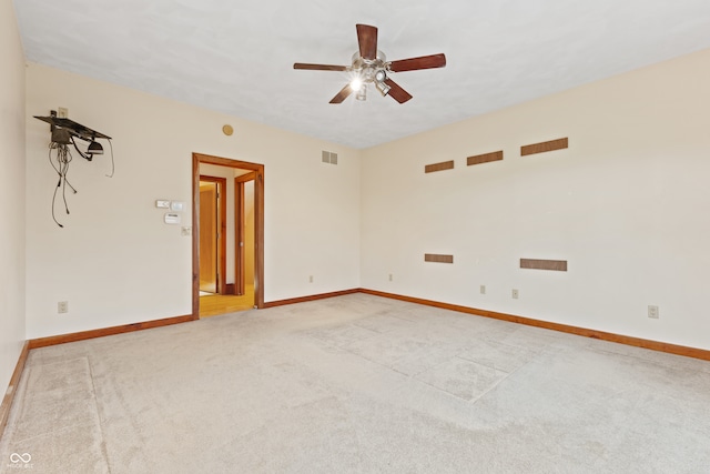 carpeted empty room with ceiling fan