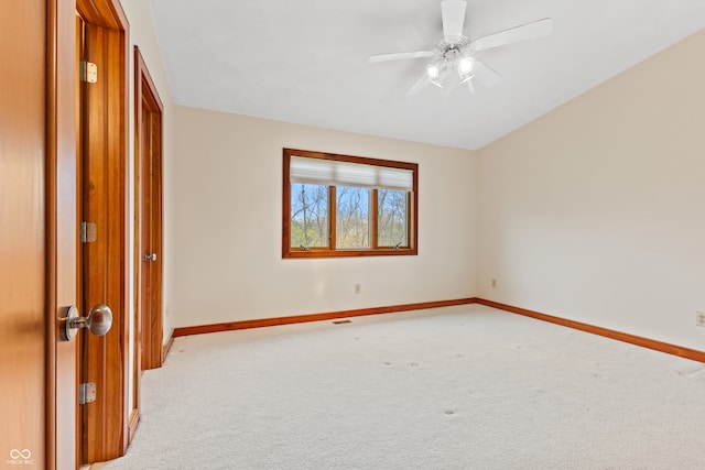 empty room featuring carpet and ceiling fan