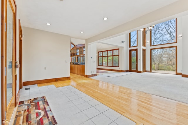 interior space with light hardwood / wood-style flooring and a wealth of natural light