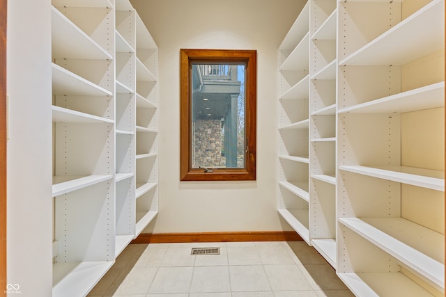 walk in closet featuring tile patterned flooring