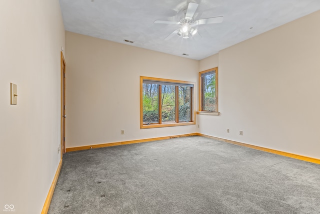 empty room with carpet flooring and ceiling fan