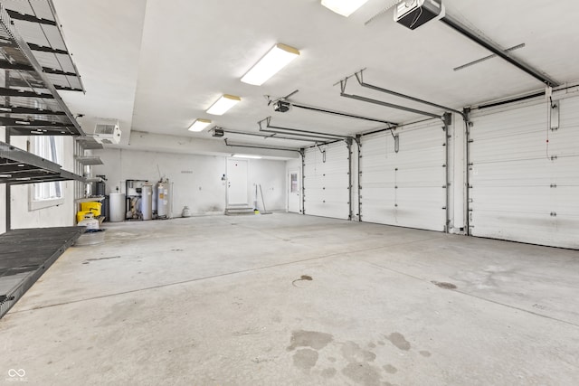 garage featuring gas water heater and a garage door opener