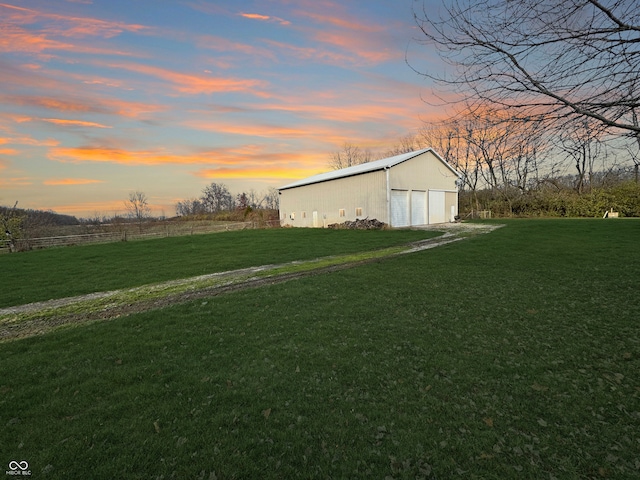 yard at dusk with an outdoor structure