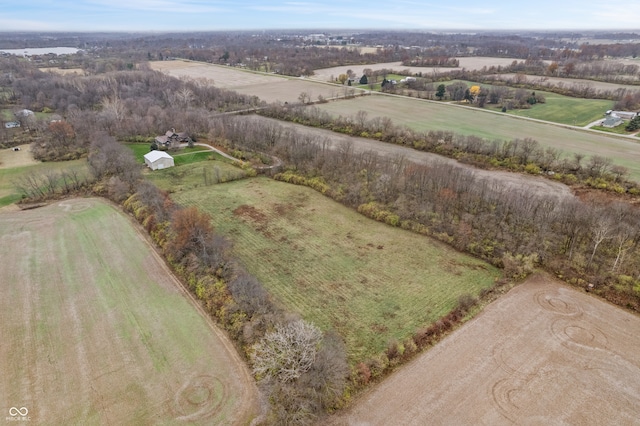 birds eye view of property with a rural view