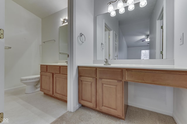 bathroom featuring ceiling fan, vanity, and toilet