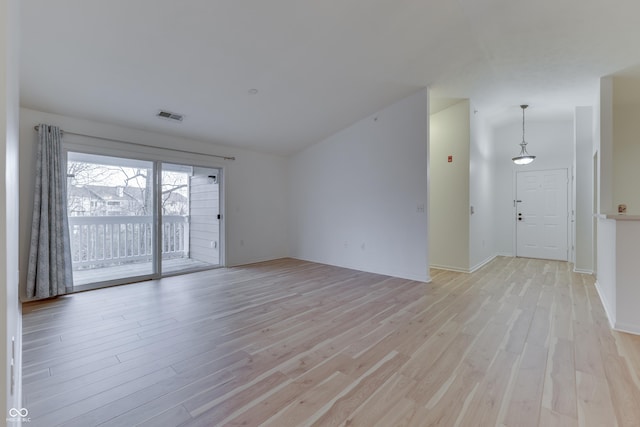 spare room with light hardwood / wood-style floors