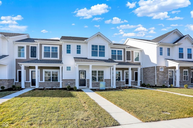 view of property featuring a front lawn