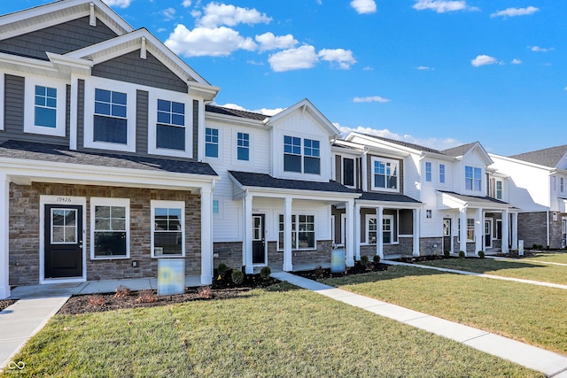 view of property featuring a front yard