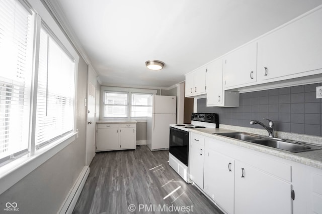 kitchen featuring dark hardwood / wood-style flooring, ornamental molding, white appliances, sink, and white cabinets