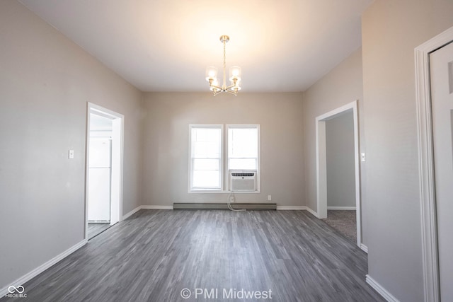 unfurnished room with a notable chandelier, cooling unit, baseboard heating, and dark wood-type flooring