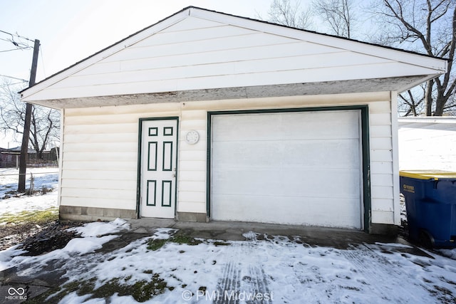 view of snow covered garage