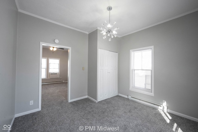 unfurnished bedroom featuring a baseboard radiator, an inviting chandelier, dark colored carpet, a closet, and ornamental molding